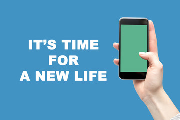 Smartphone in the woman's hand and the inscription is the time for a new life.