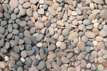 decorative stone pebble background. round gravel texture garden.