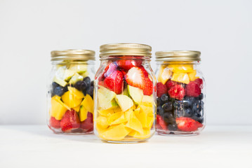 Fototapeta na wymiar Fruit and Berry Salads in Jars