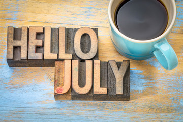Hello July word abstract in wood type