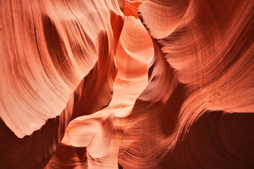 Amazing nature red sandstone textured background. Swirls of old red  sandstone wall abstract pattern in Lower Antelope Canyon, Page, Arizona, USA. Good for wallpaper. 