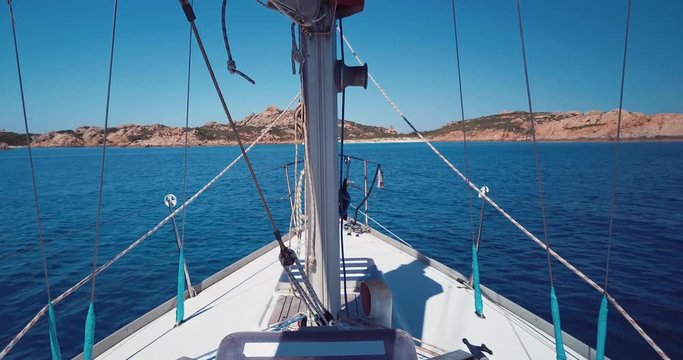 A sailboat is going to the island of Mortorio in Sardinia