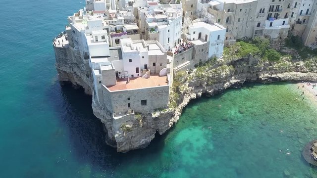 Polignano a Mare (Bari, Italy): heaven on earth. Coastal aerial 4k drone footage video above sea