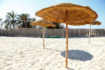 Straw umbrellas on the beach