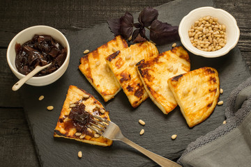 Grilled cheese, served with onion jam and Siberian pine nuts