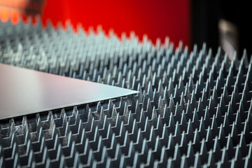 Metal sheet on laser cutting machine table