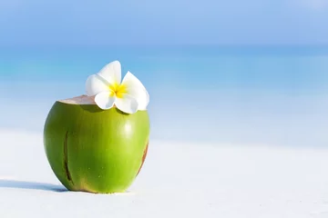 Muurstickers Fresh coconut juice decorated tropical plumeria flower © photopixel