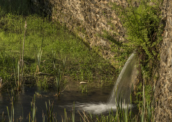 Pipe over pond in Jedlova pod Jedlovou village