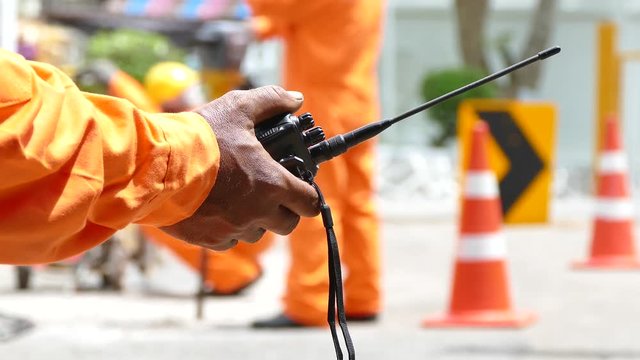Walkie Talkie or portable radio transceiver in Road construction work
