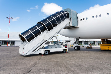 Plane ladder connected to airplane and ready to pass people at the airport