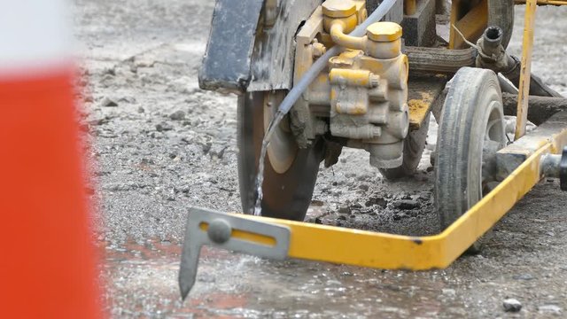 Road construction with an asphalt cutter
