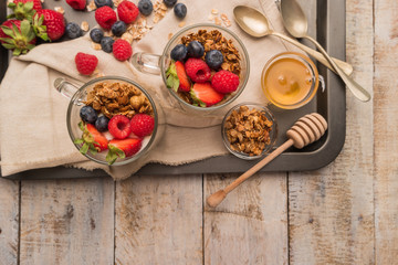 Breakfast parfait with homemade granola, fresh fruits and yogurt