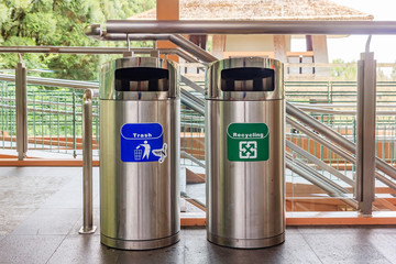 Stainless steel trash and recycle bins. types of rubbish, separated by its color, (Blue)general...
