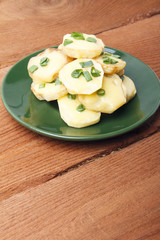 Appetizer of potatoes, cheese and green onions. There is room for text