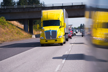 Big Rig Semi Truck on high way and truck reflaction