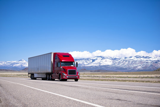 Bright Red Semi Truck Modern Transportation On Spectacular Highway