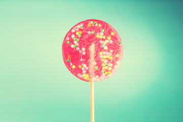Giant lollipop on blue background