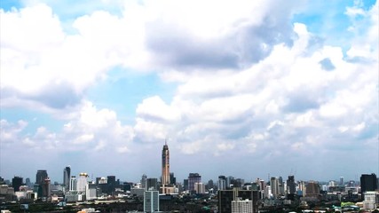 Timelapse of cloudscape over city at the beginning of rainy season