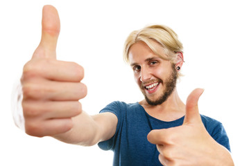 Content young man giving thumb up