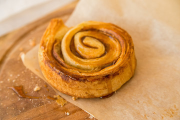 Fresh cinnamon roll on paper
