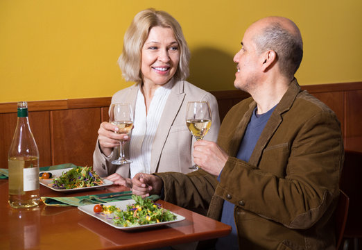 Positive  Mature Couple Having Dinner At Restaurant
