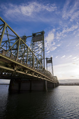 Metal truss bridge with triangles and towers across Columbia River
