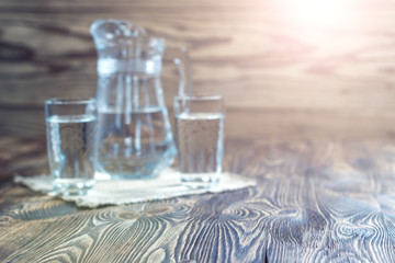 Rustic background. Vintage table and glasses of water