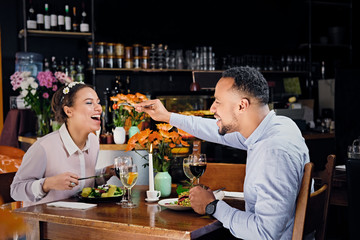 Black American male and female eating vegan food.