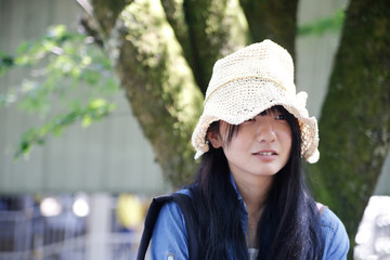 young asian woman hat portrait