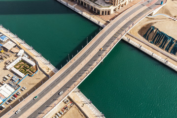 Aerial view of a highway in Dubai, UAE, with traffic. Scenic daytime skyline. Travel and architecture background. © Funny Studio
