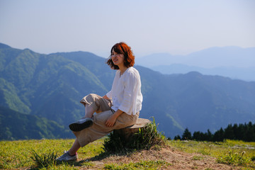 Naklejka na ściany i meble Japanese woman on green mountain