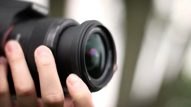 Close up of DSLR camera recording video or shooting photographs