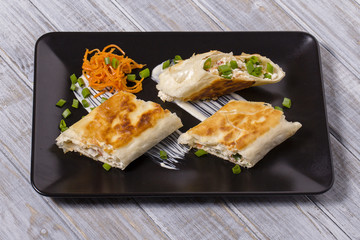 Pita bread wrapped with cottage cheese and vegetables
