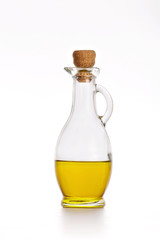 Olive oil in a bottle on white