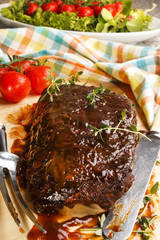 marinated pork ribs on wooden board