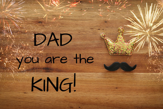 Top view image of funny mustache and glitter crown. Father's day concept