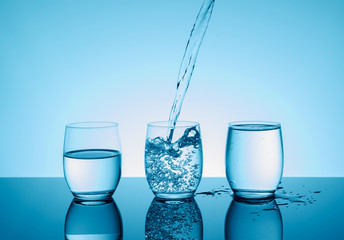 Creative splashing water in the glass