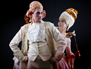 Man and woman in ancient costumes and white wigs - obrazy, fototapety, plakaty