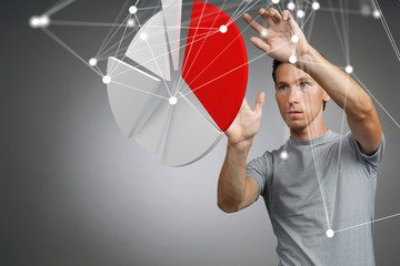 Man shows a pie chart, circle diagram. Business analytics concept.