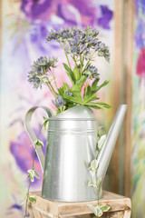 Vintage country house interior with a table with a vase and flovers