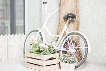 Fototapeta na wymiar Reused bycycle with baskets of flowers