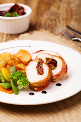 Delicious chicken rolls with dried tomatoes and mozzarella.