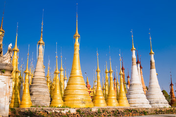 Fototapeta premium Scenic view of colorufl pagodas in Indein village Pagoda at Inle Lake, Myanmar