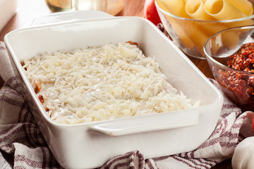 Cannelloni stuffed with meat cooked in a casserole dish ready for baking