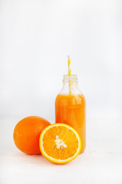 Orange juice and fresh oranges. The concept of beverages, health food and diet.