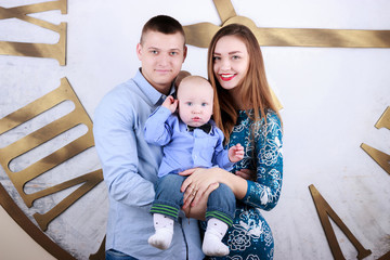 family with big watch on background