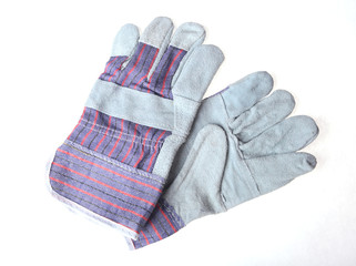 Pair of grey protective work gloves isolated on a white background.