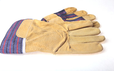 Pair of protective work gloves isolated on a white background.