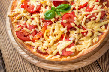 delicious italia pizza in a restaurant, on the wooden desk