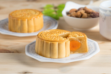 Mooncake with tea cup and nuts.